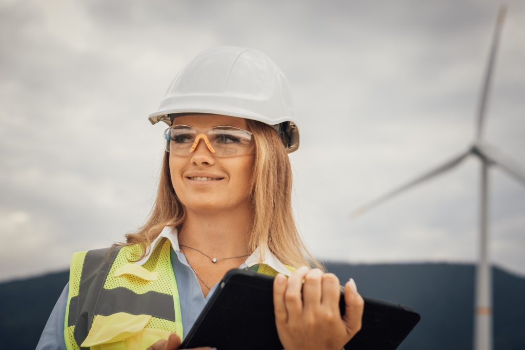 Professional Female Engineer at Wind Farm Monitoring Operations